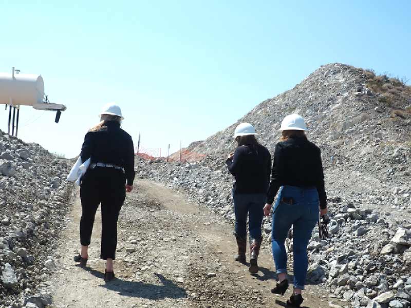 C and S staff walking a gravel haul road